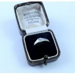 A yellow metal ring set with solitaire diamond in a white metal surround, maker's mark AWG & S Ltd,