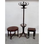 A Thonet-style bentwood coat stand and a modern coffee table on reeded legs and partial nest of two