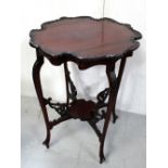 A mahogany occasional table with carved shaped top to cabriole legs to pad feet united by under