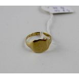 A 9ct gold signet ring of shield form, rubbed initials to middle. Chester hallmarked, approx 3.9g.