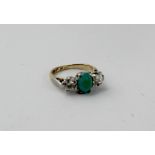 An 18ct gold and platinum ring set with two diamonds and a turquoise, size G, approx 2.4g.