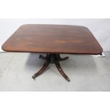 An early 19th century mahogany tilt-top breakfast table on vase turned column,