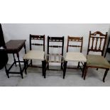 A set of three walnut-framed dining chairs with bobbin-turned supports,