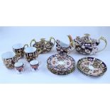 A Royal Crown Derby part bachelor tea set, pattern number 2451 comprising teapot, sucrier, milk jug,