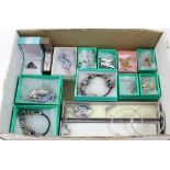 A quantity of silver and white metal jewellery to include bangles and brooches etc.