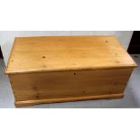 A pine blanket box, the interior with candle drawer, on bracket feet, width 111cm.