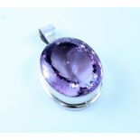 A silver pendant, marked 925, set with large amethyst, approx 46 x 39 x 19mm.