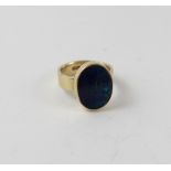 A 9ct yellow gold dress ring set with oval dark green/blue opal type stone, size I, approx 4.4g.