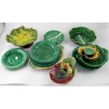 A mixed group of Victorian English and Continental cabbage leaf patterned pottery plates,