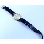 Vertex; a gentlemen's wristwatch in gold case, silvered dial set with single number increments,