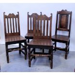 Three Georgian oak slat-back dining chairs with incised decoration and raised on stretchered turned
