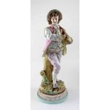 A 19th century Continental figure of a gentleman playing a musical instrument, on rounded base,
