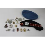 A Liverpool Scottish Glengarry UN beret with badge and a collection of badges to include Liverpool
