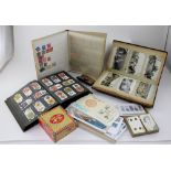 A collectors' lot to include postcard albums, a cigarette card album, a stamp album,