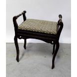 An Edwardian stained beech piano stool with upholstered lift-up seat, width 52cm.