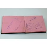 A small album containing sporting autographs mostly cricket and golf from the 1970s including