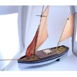 A remote control scratch-built wooden two mast yacht, grey tone with white hull, length 95cm.