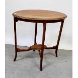 An Edwardian mahogany and inlaid oval occasional table with lower tier, width 72cm.