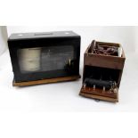 A GEC barograph in black metal case with a late 19th century therapeutic electric shock machine in