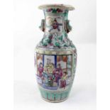 A late 19th century Chinese Famille Rose vase with everted rim,