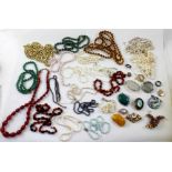 A quantity of costume jewellery to include necklaces, pendants, brooches, earrings etc.