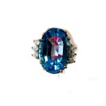 *** to be RTV In office safe A 9ct gold chip diamond and large blue topaz dress ring,