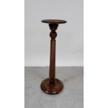 A 19th century mahogany torchère stand raised on single turned column, height 83cm.