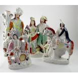 Four Staffordshire flatback figures, a gentleman with dog, a farmer and his wife,