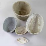 A quantity of 19th century kitchenalia including five pottery jelly moulds of various sizes (hi -