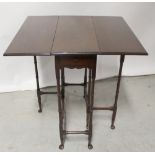 An 18th century style mahogany gateleg table on ring turned supports and pad feet,