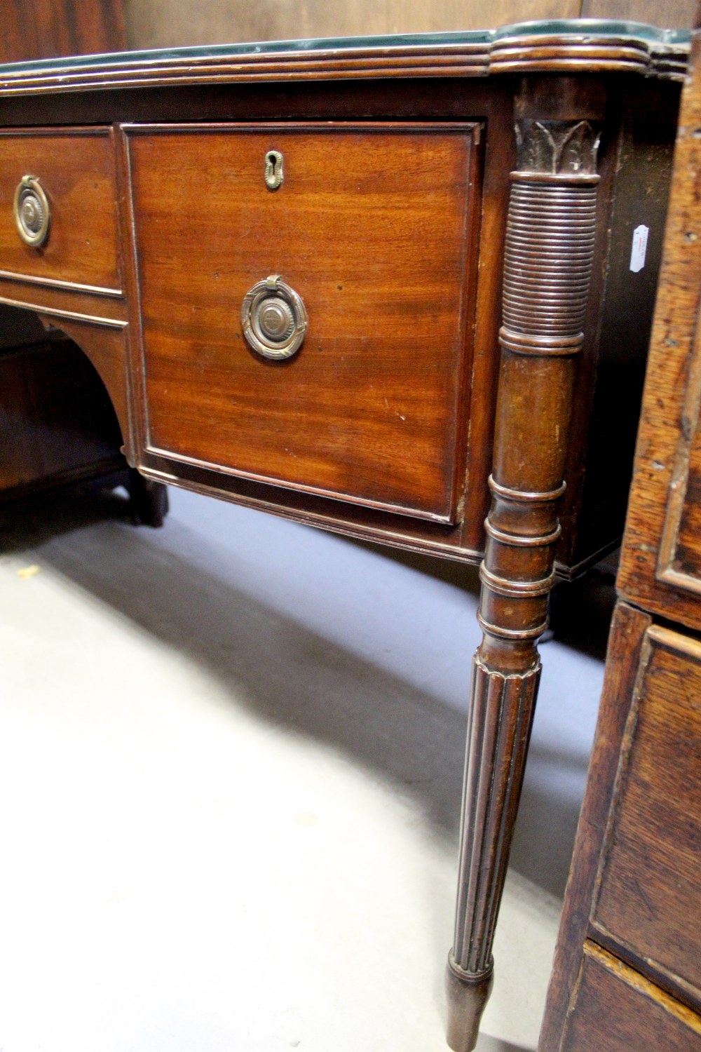 A 19th century mahogany bow-front sideboard, the top shaped with corner lugs and fitted glass top, - Image 3 of 4