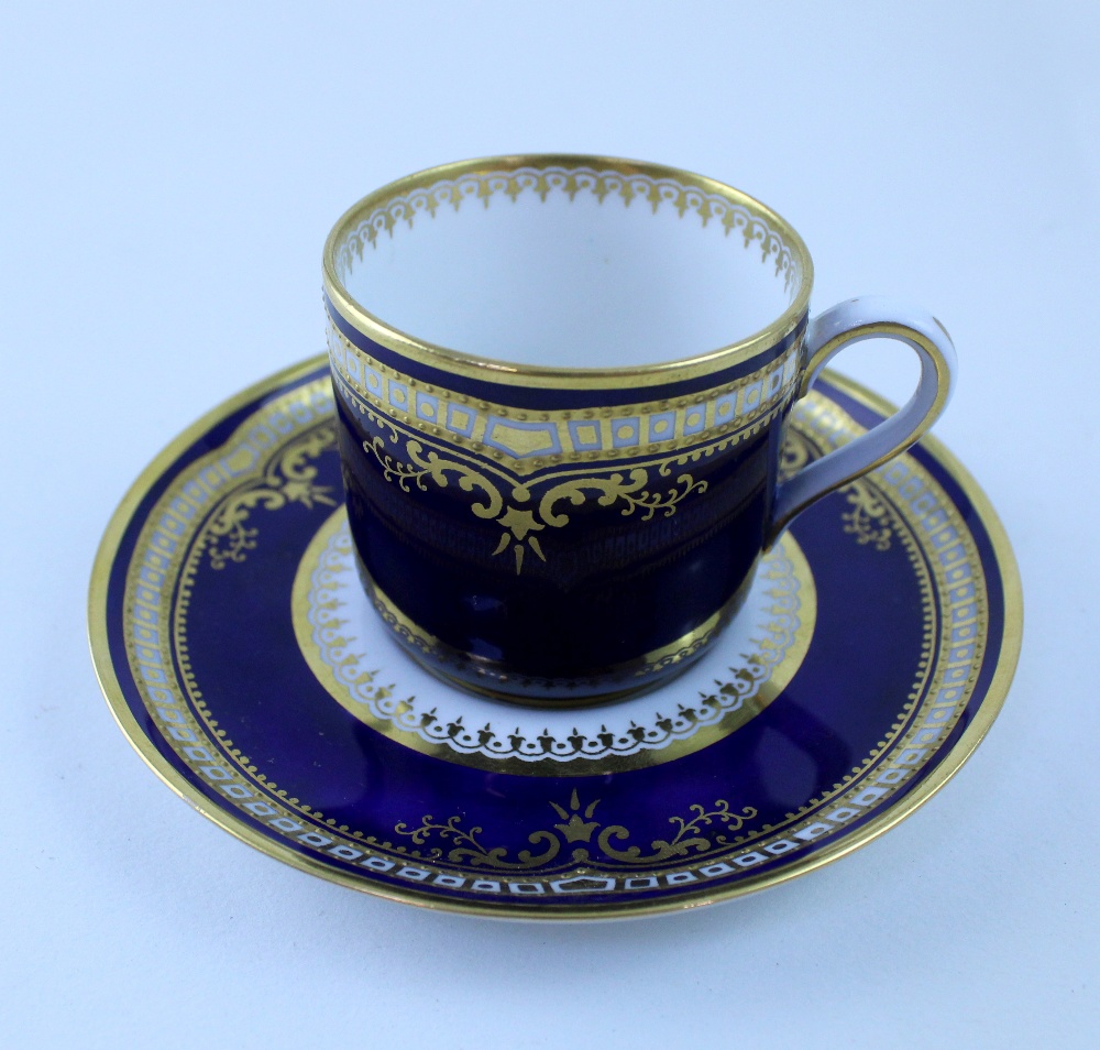 An early 20th century Spode cobalt blue ground and gilt coffee cup and saucer, Registered No.