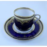 An early 20th century Spode cobalt blue ground and gilt coffee cup and saucer, Registered No.