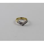 An 18ct gold five-stone wishbone diamond ring with graduated stones,