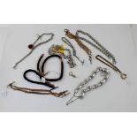 A quantity of silver and gold plated chains and braided hair bracelets.