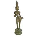 A large 19th century Southeast Asian bronze figure of Tara raised on a pierced shaped circular base,