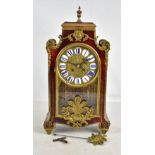 An early to mid 20th Century French boulle work mantel clock, the circular dial set with applied