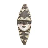 A Washkuk Yina mask, Papua New Guinea, with traces of painted decoration, length 71cm.Additional