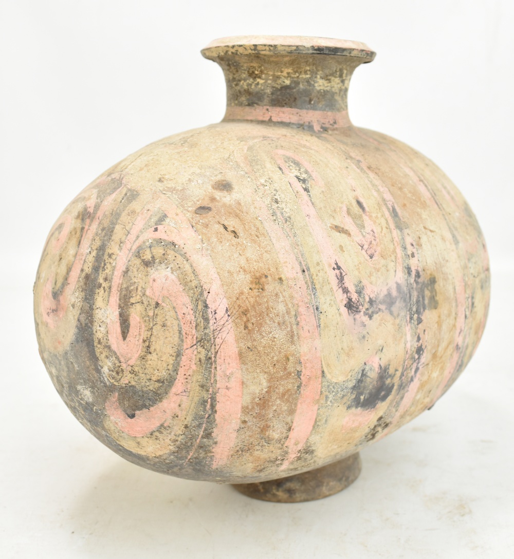 A Chinese Han dynasty earthenware cocoon vase with simple painted stylised detail on circular - Image 4 of 10