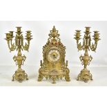 A reproduction gilt metal three piece clock garnature with pierced ornate decoration, the dial