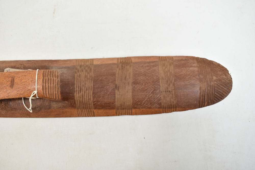 A mid-20th century Northern Australian parrying shield with bands of simple carved decoration, - Image 4 of 11