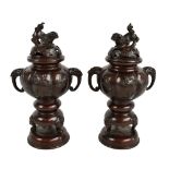 MURAKAMI; a pair of Japanese Meiji period bronze koro, each with chi chi pierced finials above