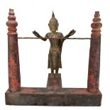 A 19th century or earlier Burmese gilded and carved wooden figure of Buddha, ex-temple, mounted on a