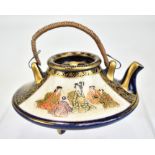 An early 20th century Japanese porcelain Satsuma miniature kyushu or hot water pot with gilt and
