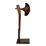 A South African ceremonial axe on stand, height 49cm.