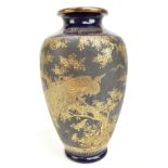 A Japanese Satsuma Meiji period vase, decorated in gilt with a peacock perching on a branch,