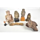 A small group of ancient Southeast Asian carvings and fragments including a Quan Yin (Guanyin)