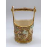 KINKOZAN; a Japanese Meiji period Satsuma pail decorated with panels of floral sprays on a
