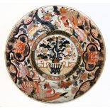 A very large late 17th century Japanese Arita charger decorated in the Imari palate, centred with an