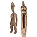 A large early 20th century African tribal Chokwe figure with pronounced coiffure, height 71cm, and a